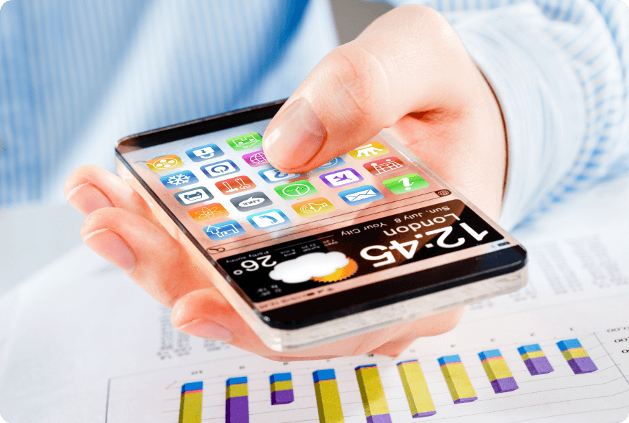 Person using a smartphone over growth charts