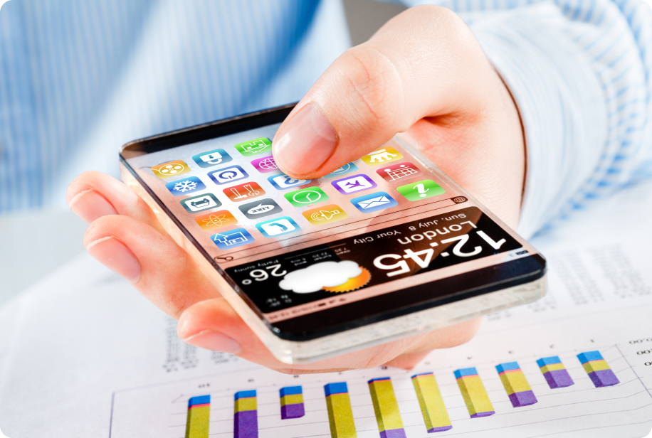 Person using a smartphone over growth charts